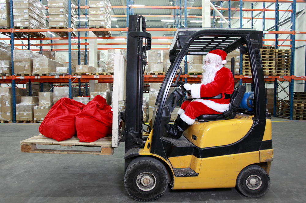 santa working in warehouse image