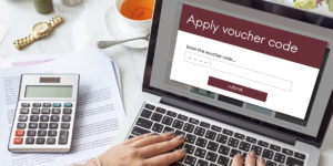 a voucher code being applied to an online checkout